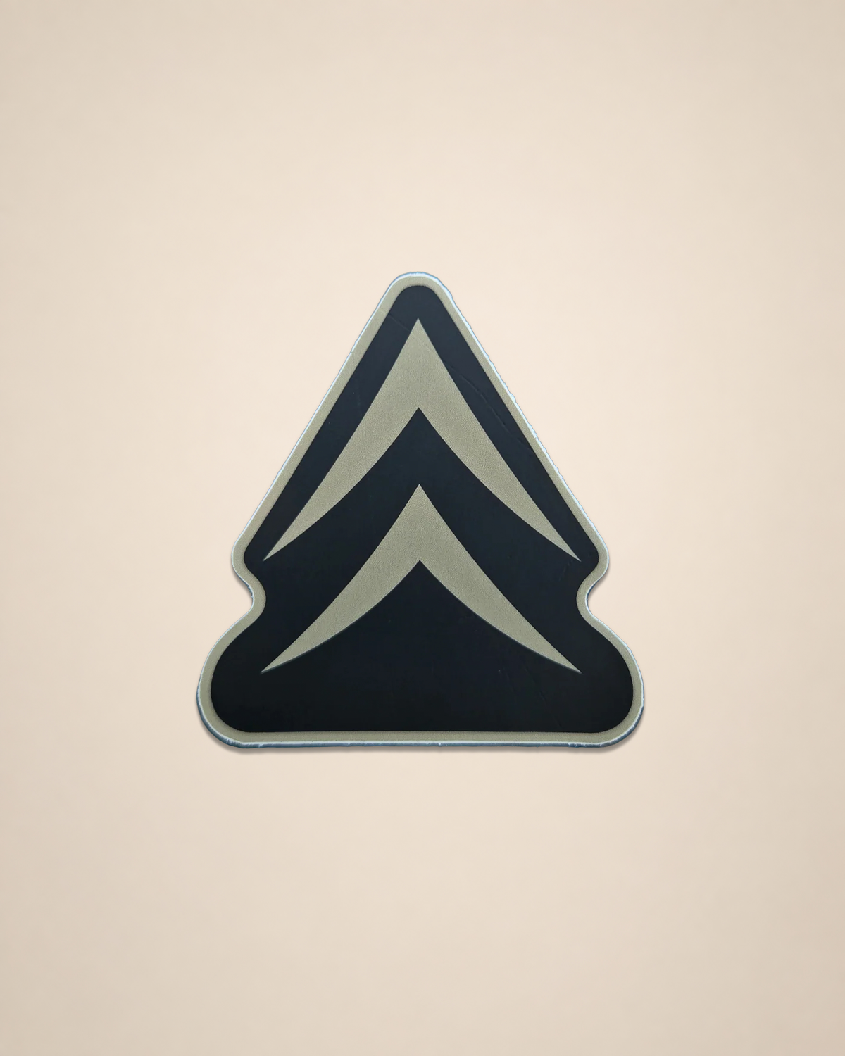 Alpine Chevron vinyl sticker featuring the Black Timber chevron mark on a cream background.