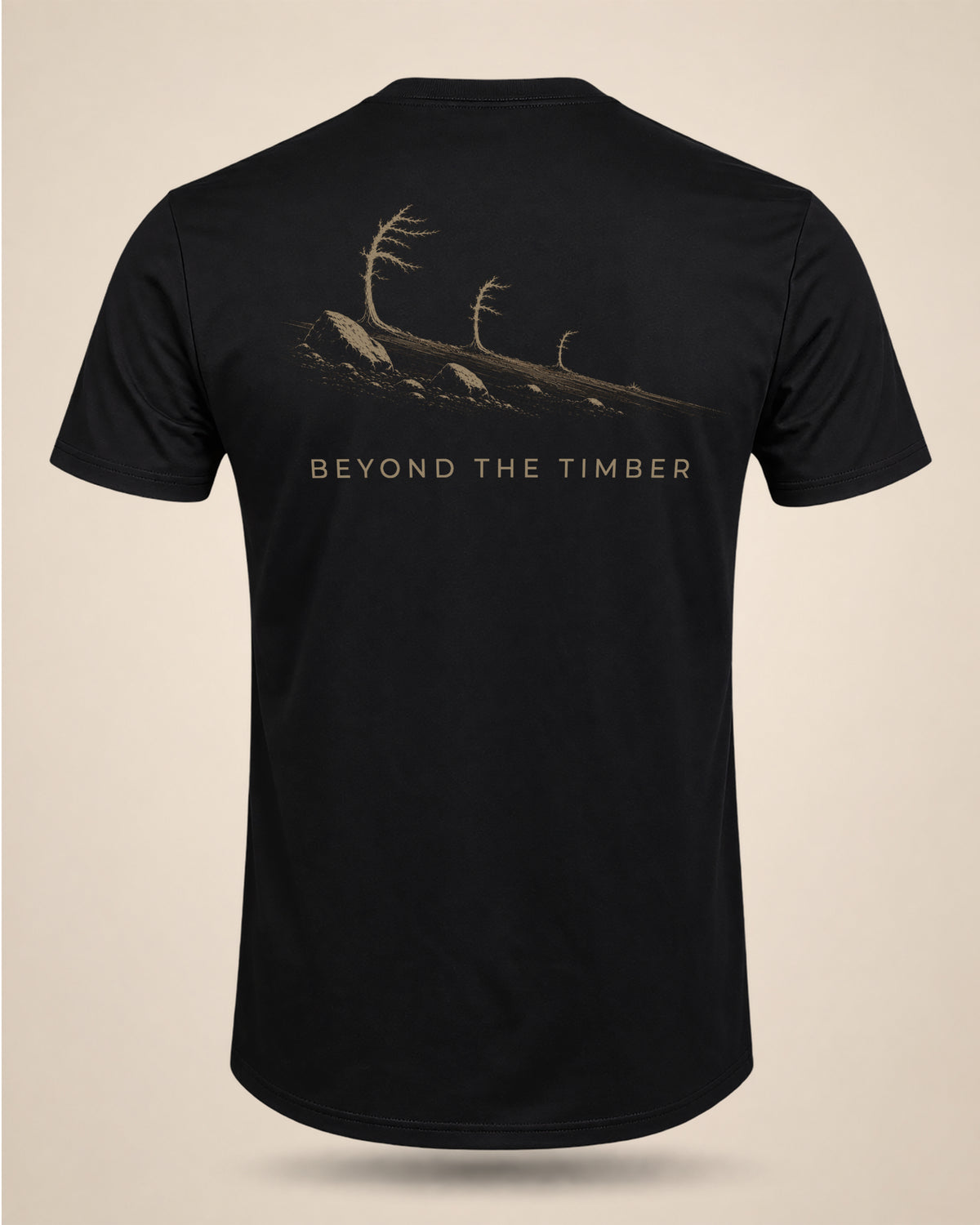 Black Beyond The Timber T-shirt featuring an alpine ridgeline and tree-line graphic on the back.