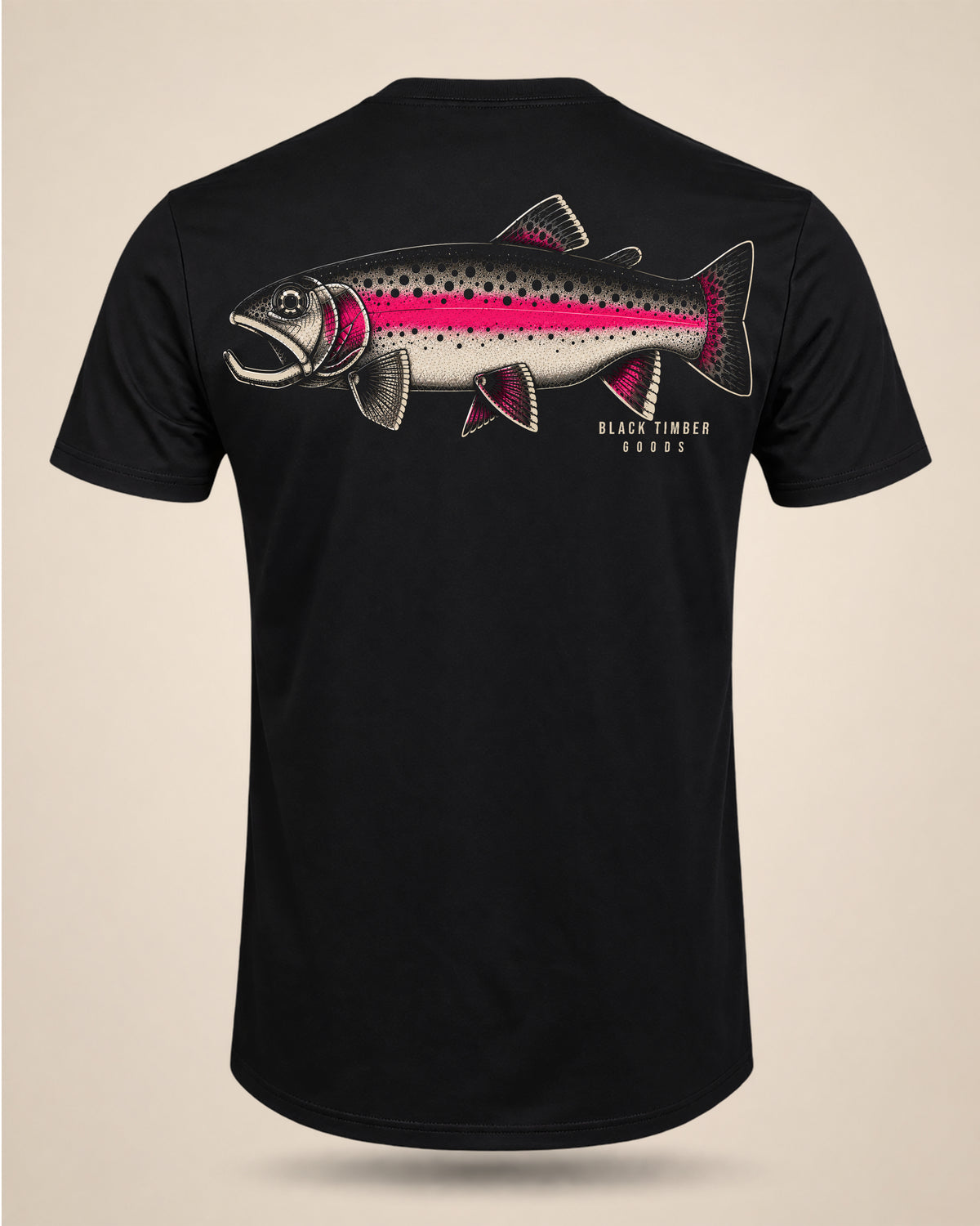 Black Cold Water trout fishing T-shirt featuring a large illustrated rainbow trout graphic with black spotting and a bright pink lateral stripe.