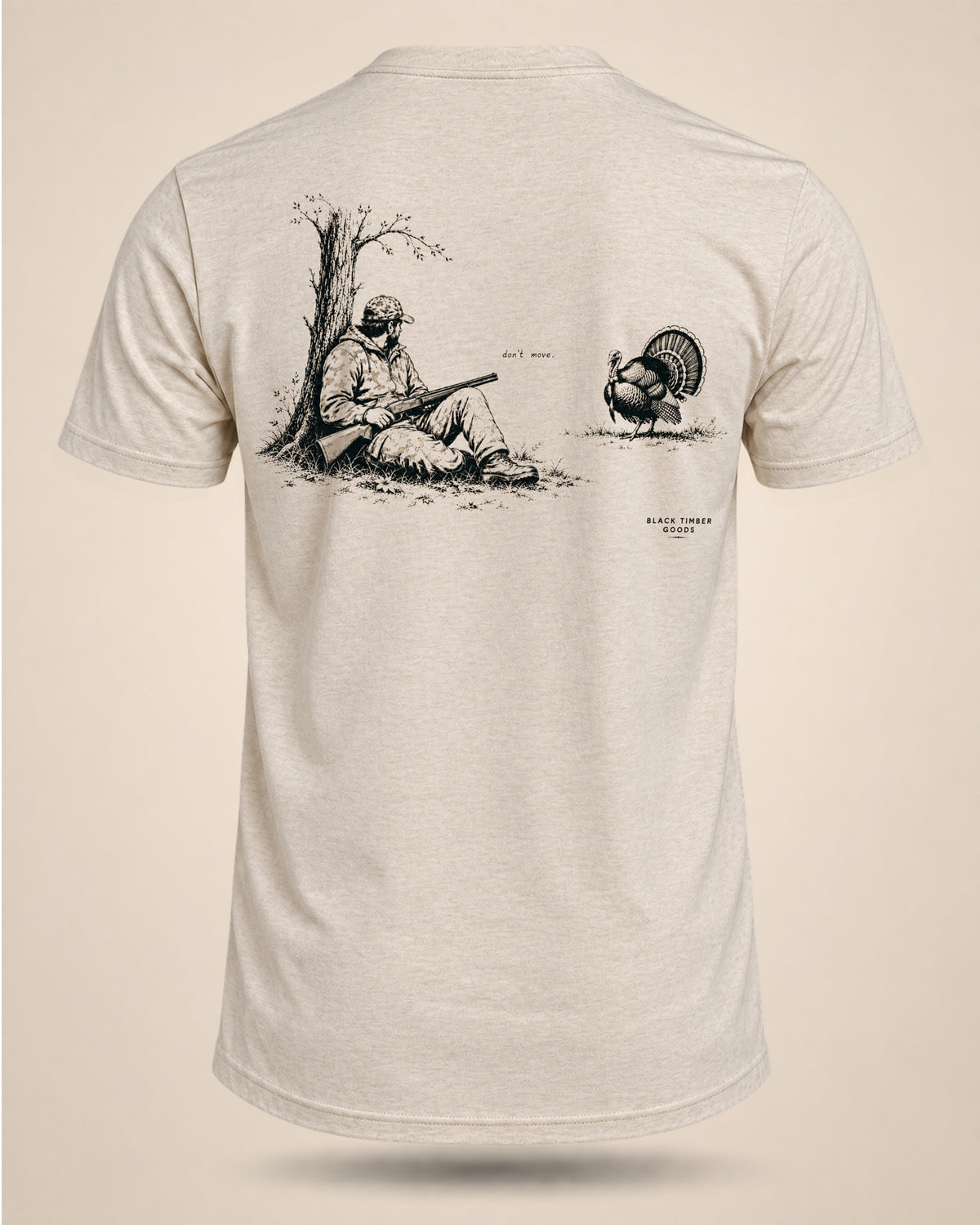 Cream Don’t Move hunting T-shirt featuring a seated hunter and strutting turkey graphic on the back.