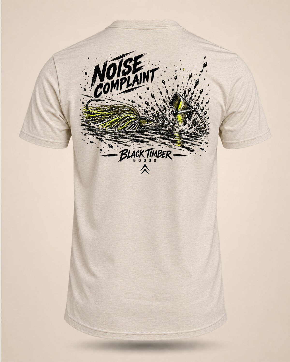 Cream Noise Complaint bass fishing T-shirt featuring a black and chartreuse buzzbait splashing across the water on the back.