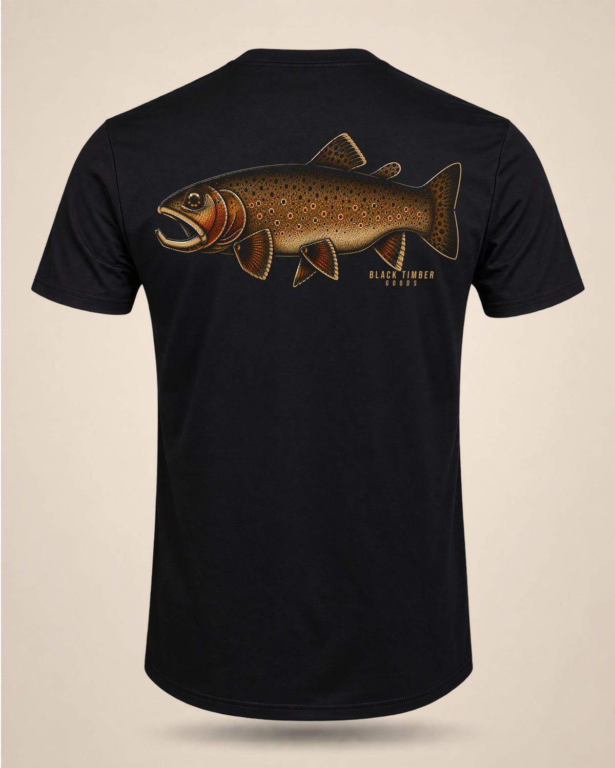 Old Gold fly-fishing T-shirt featuring a large brown trout and Black Timber Goods branding.