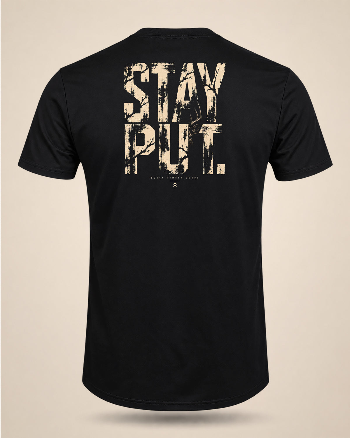 Back view of black Stay Put whitetail hunting t-shirt with hidden buck and woodland typography graphic