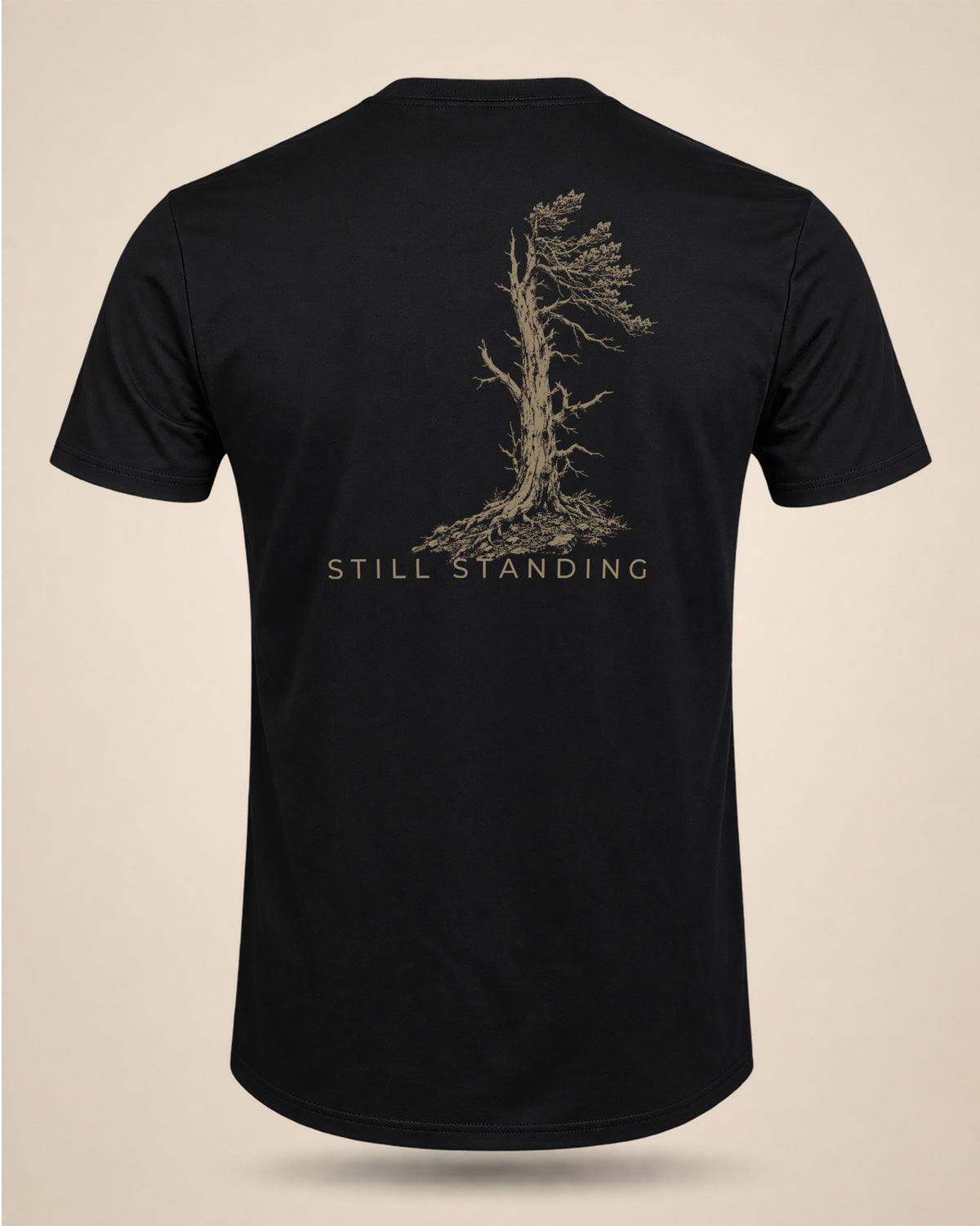 Black Still Standing T-shirt featuring a weathered lone-tree graphic on the back.