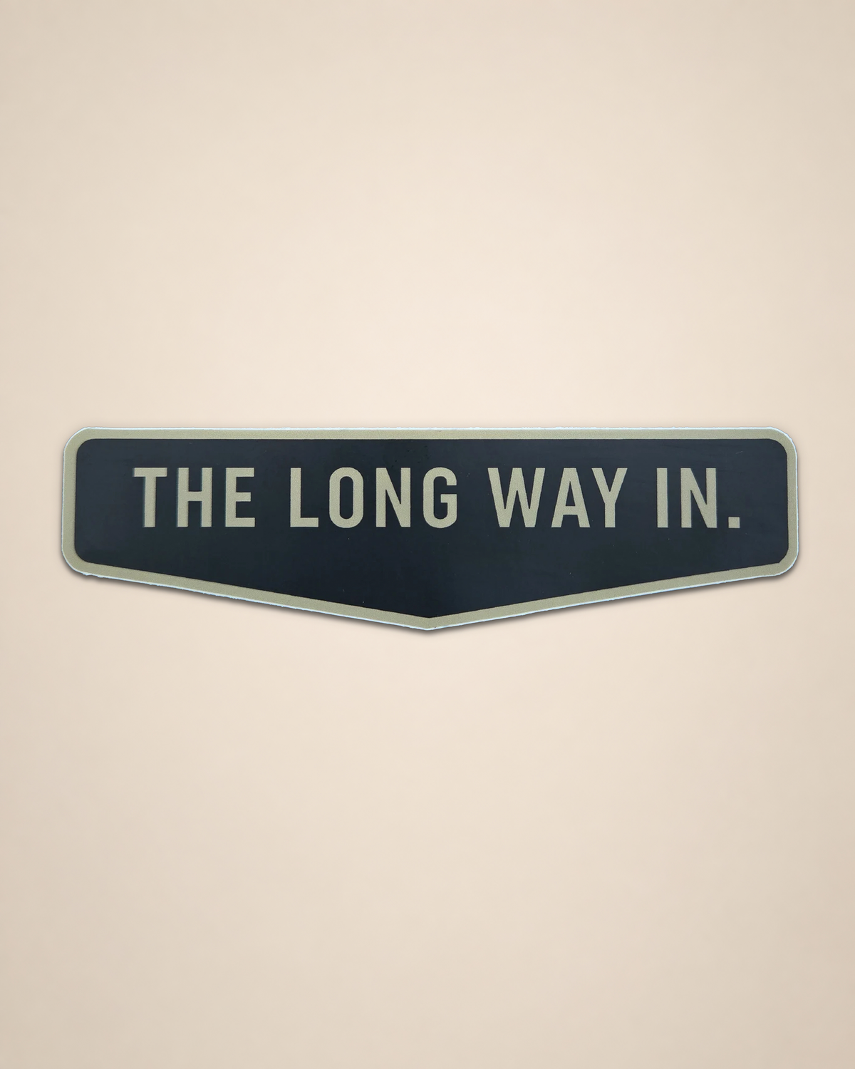 The Long Way In vinyl sticker featuring a rectangular Black Timber typography graphic on a cream background.