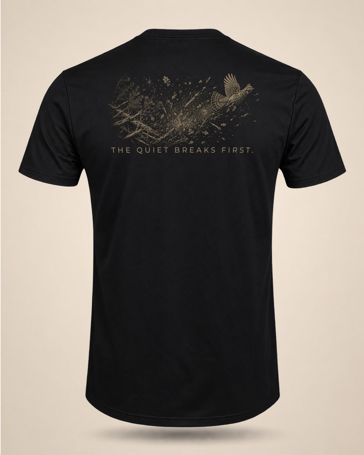 Black The Quiet Breaks First hunting T-shirt featuring a grouse flushing from woodland cover on the back.