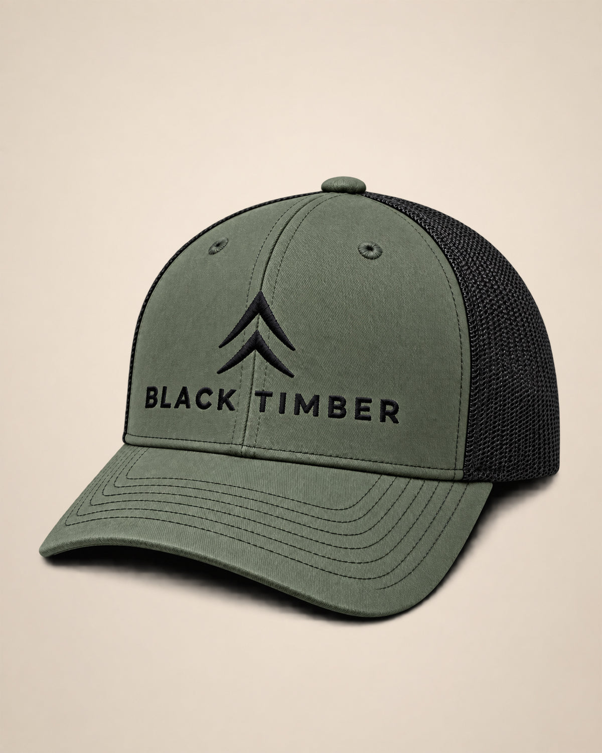 Olive Timber Mark trucker hat with black Alpine Chevron and Black Timber embroidery on the front.