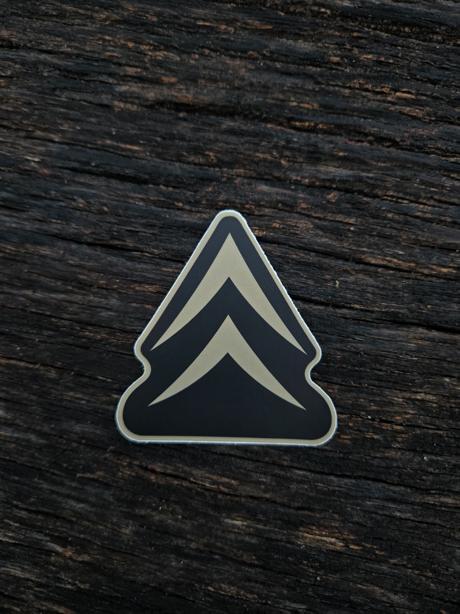 Alpine Chevron waterproof vinyl sticker by Black Timber Goods on weathered wood.