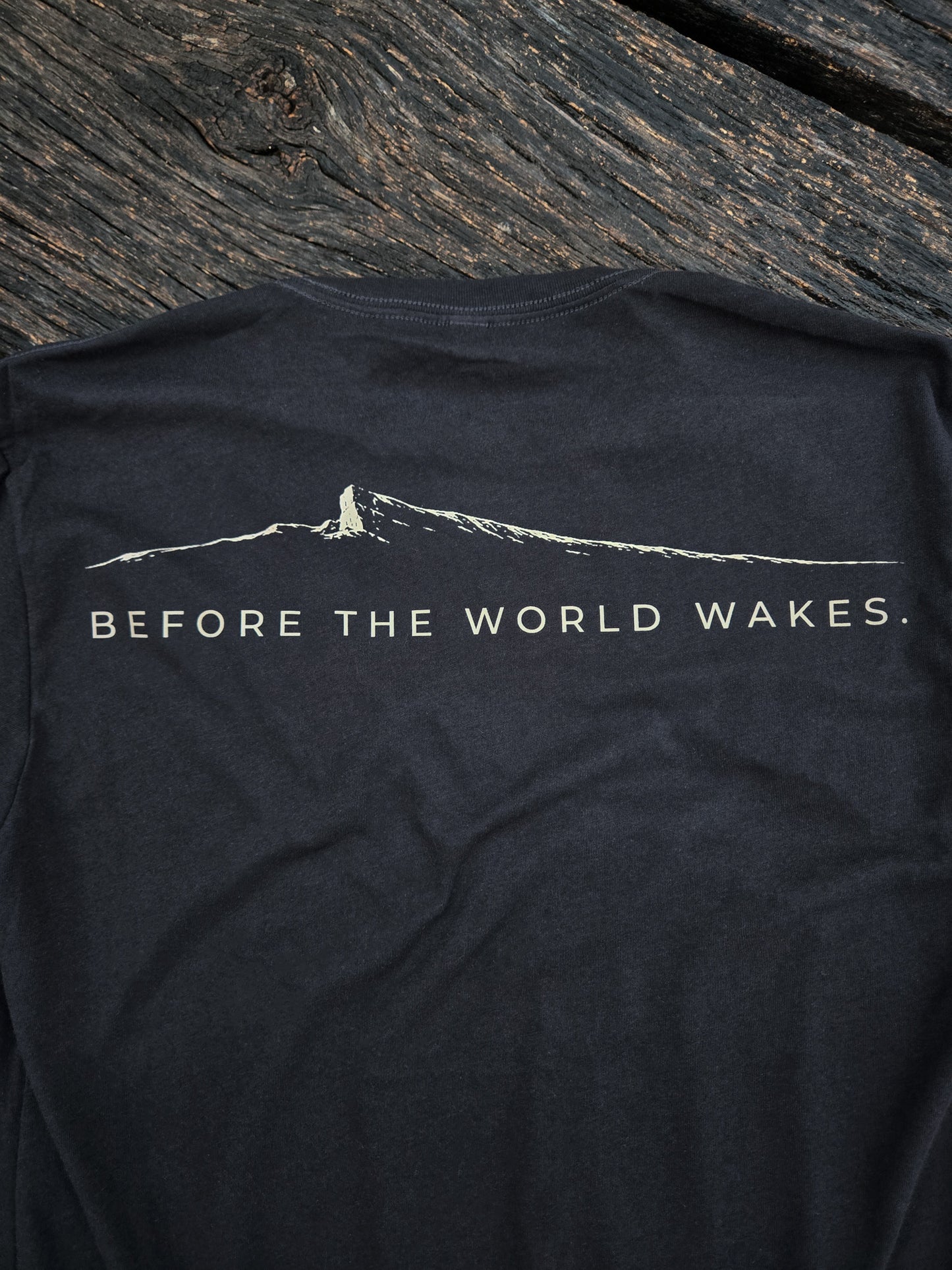 Back graphic of the Before The World Wakes outdoor shirt by Black Timber Goods.