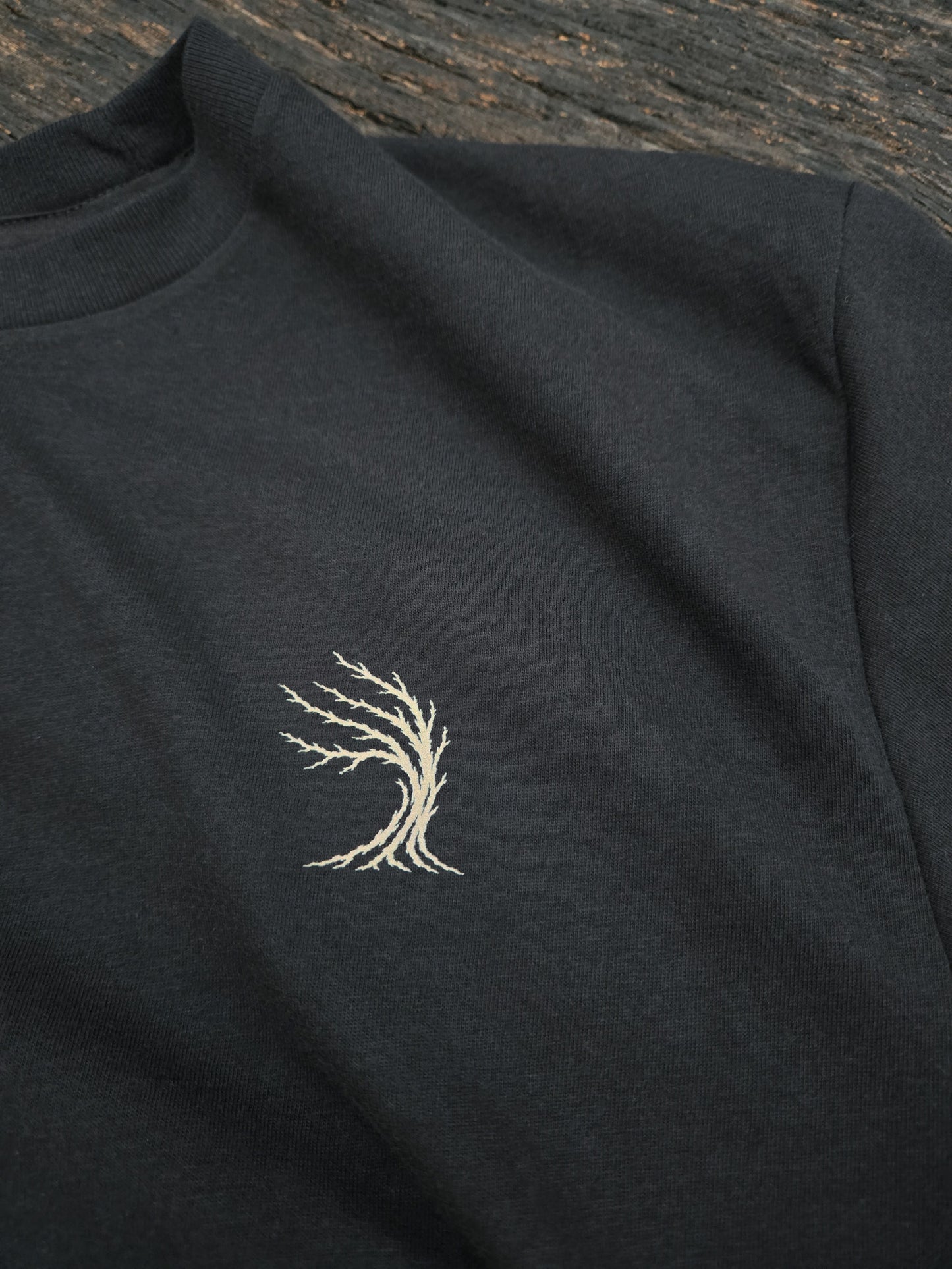 Weather Tree chest mark on the Beyond The Timber mountain shirt.