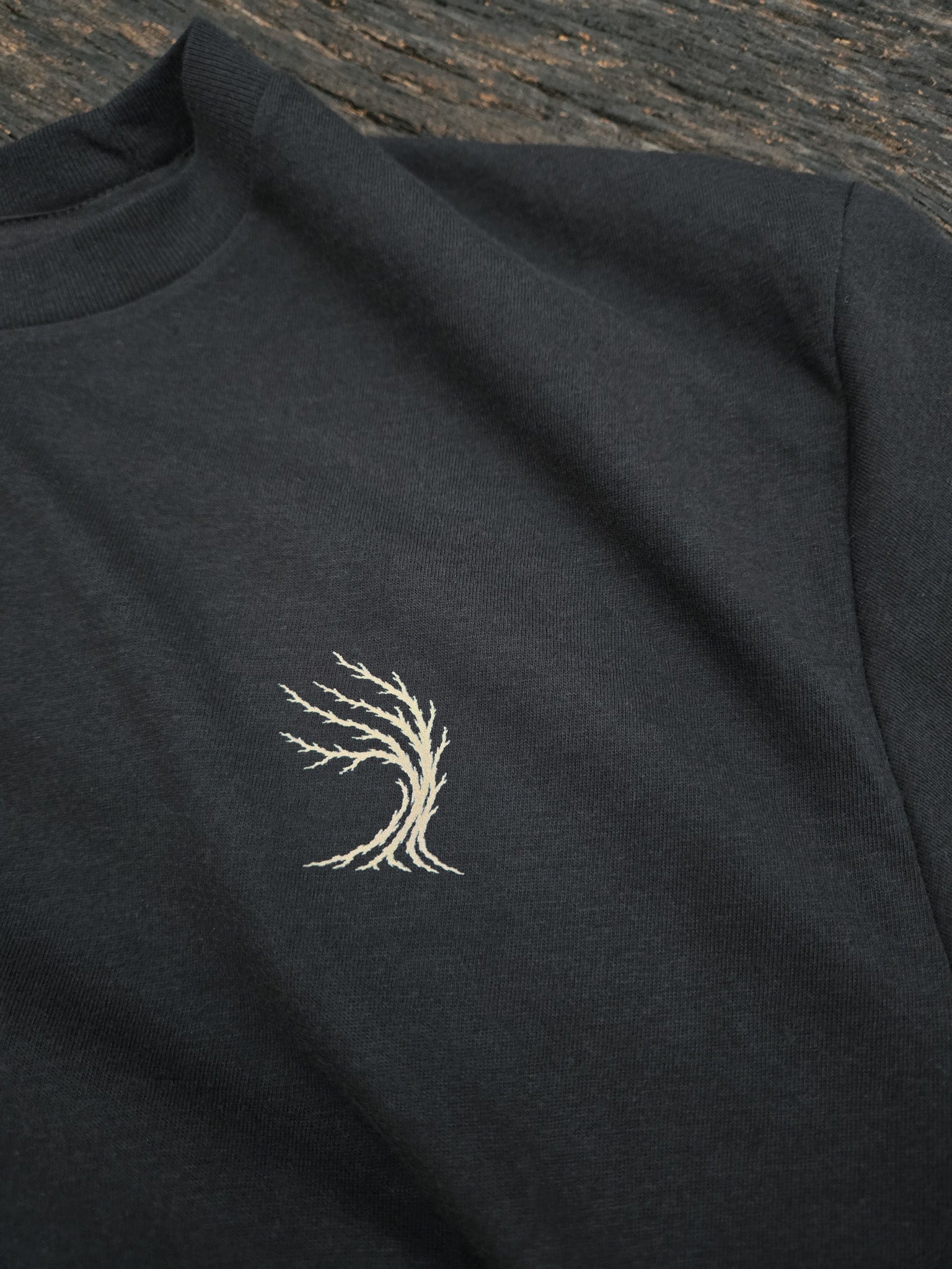 Weather Tree chest mark on the Beyond The Timber mountain shirt.