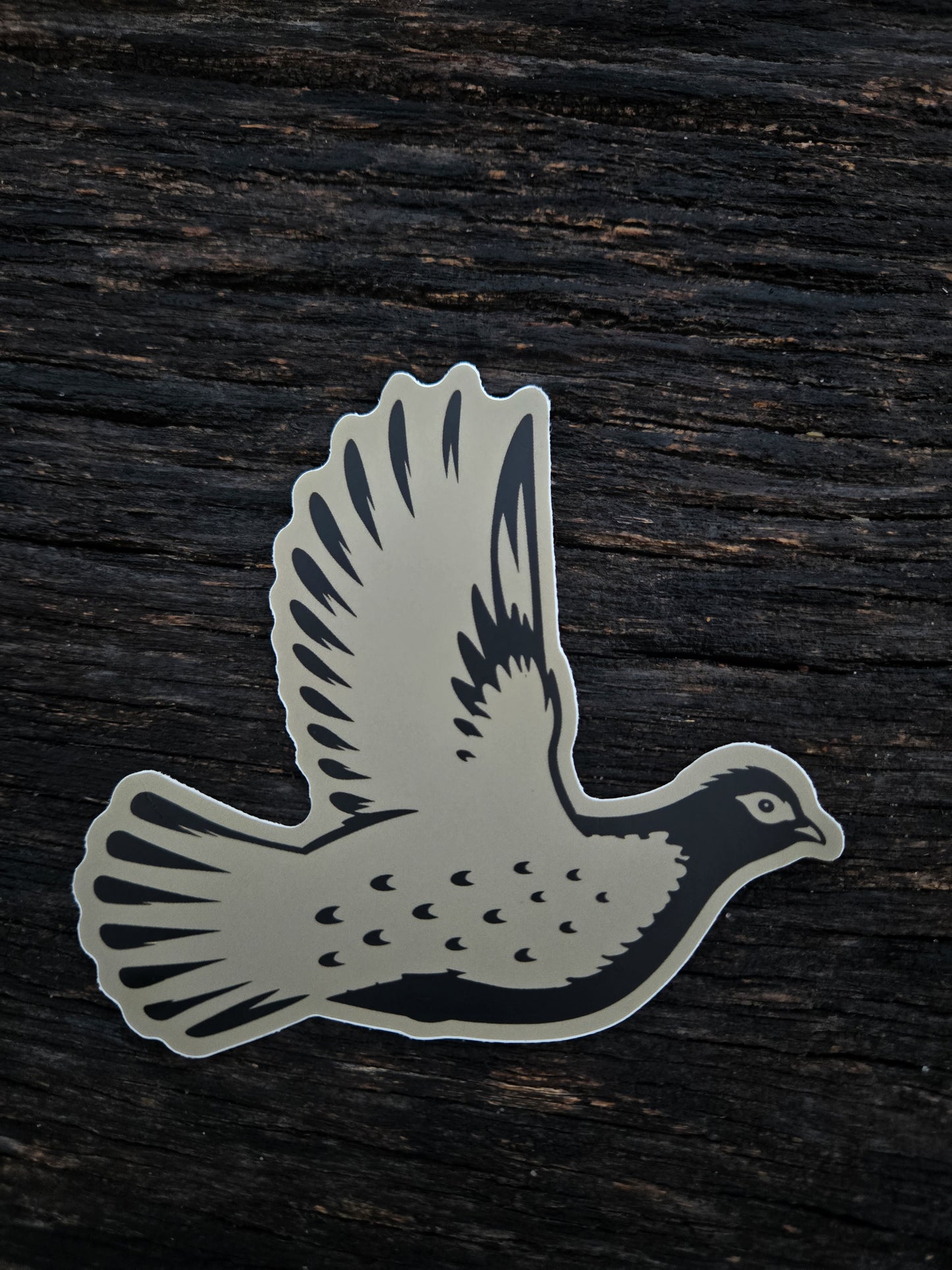 Grouse Flush waterproof vinyl sticker by Black Timber Goods featuring a flying grouse silhouette.