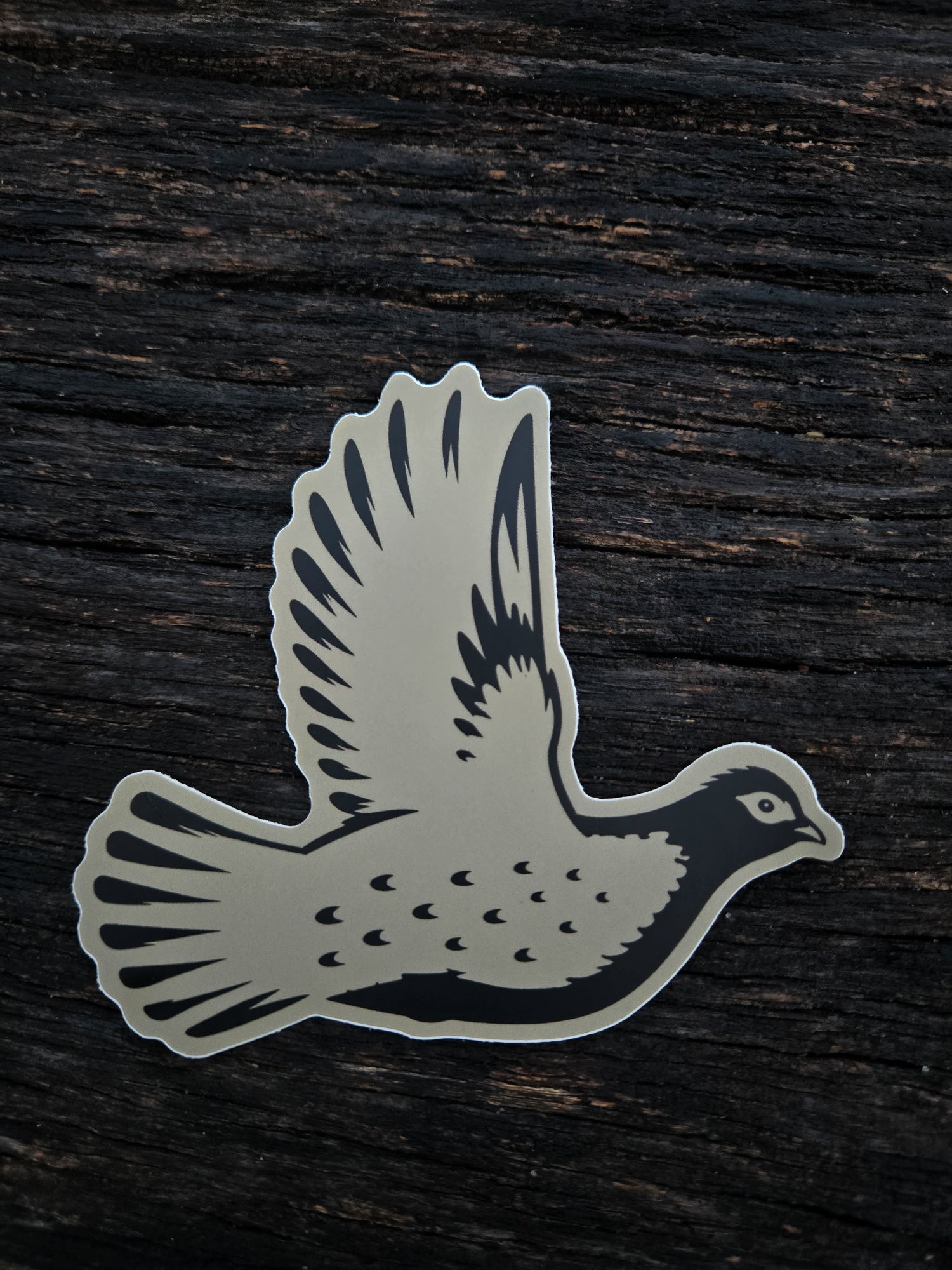 Grouse Flush waterproof vinyl sticker by Black Timber Goods featuring a flying grouse silhouette.