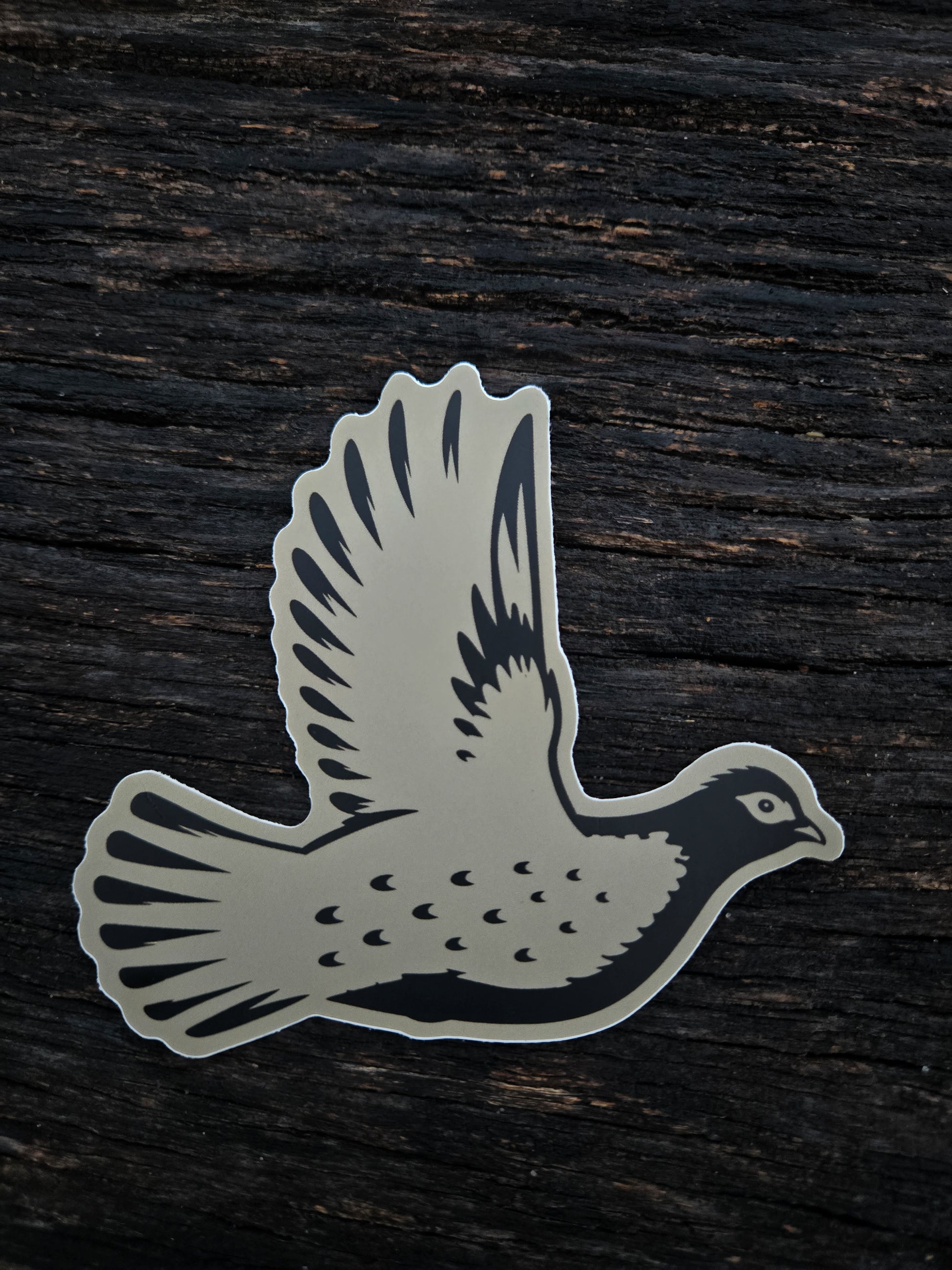 Grouse Flush waterproof vinyl sticker by Black Timber Goods featuring a flying grouse silhouette.