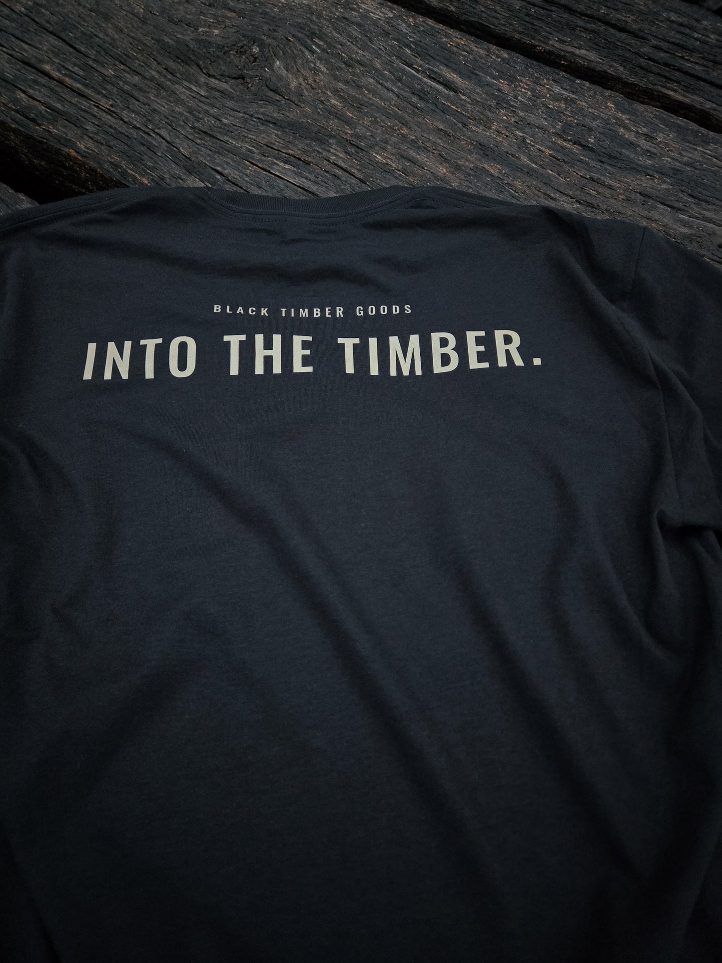 Close-up of Into The Timber typography artwork.
