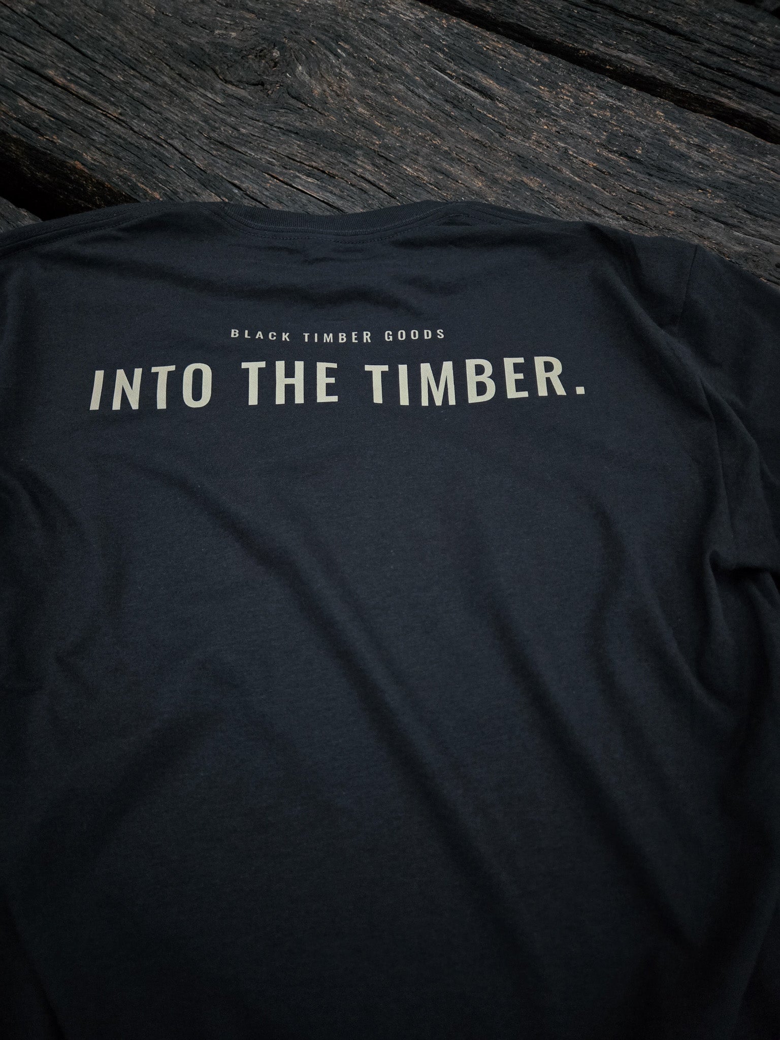 Close-up of Into The Timber typography artwork.
