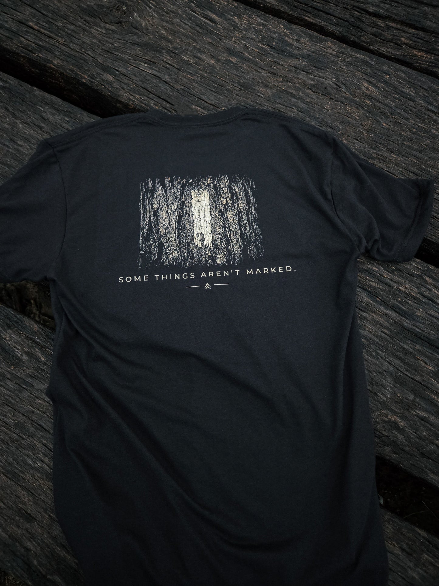 Back of Some Things Aren't Marked trail blaze shirt by Black Timber Goods featuring a weathered trail blaze graphic.