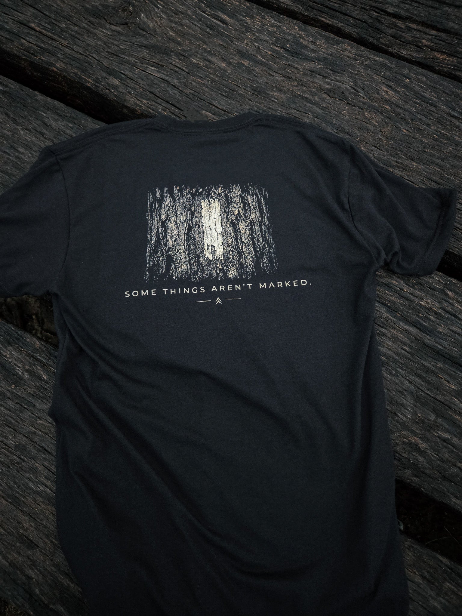 Back of Some Things Aren't Marked trail blaze shirt by Black Timber Goods featuring a weathered trail blaze graphic.