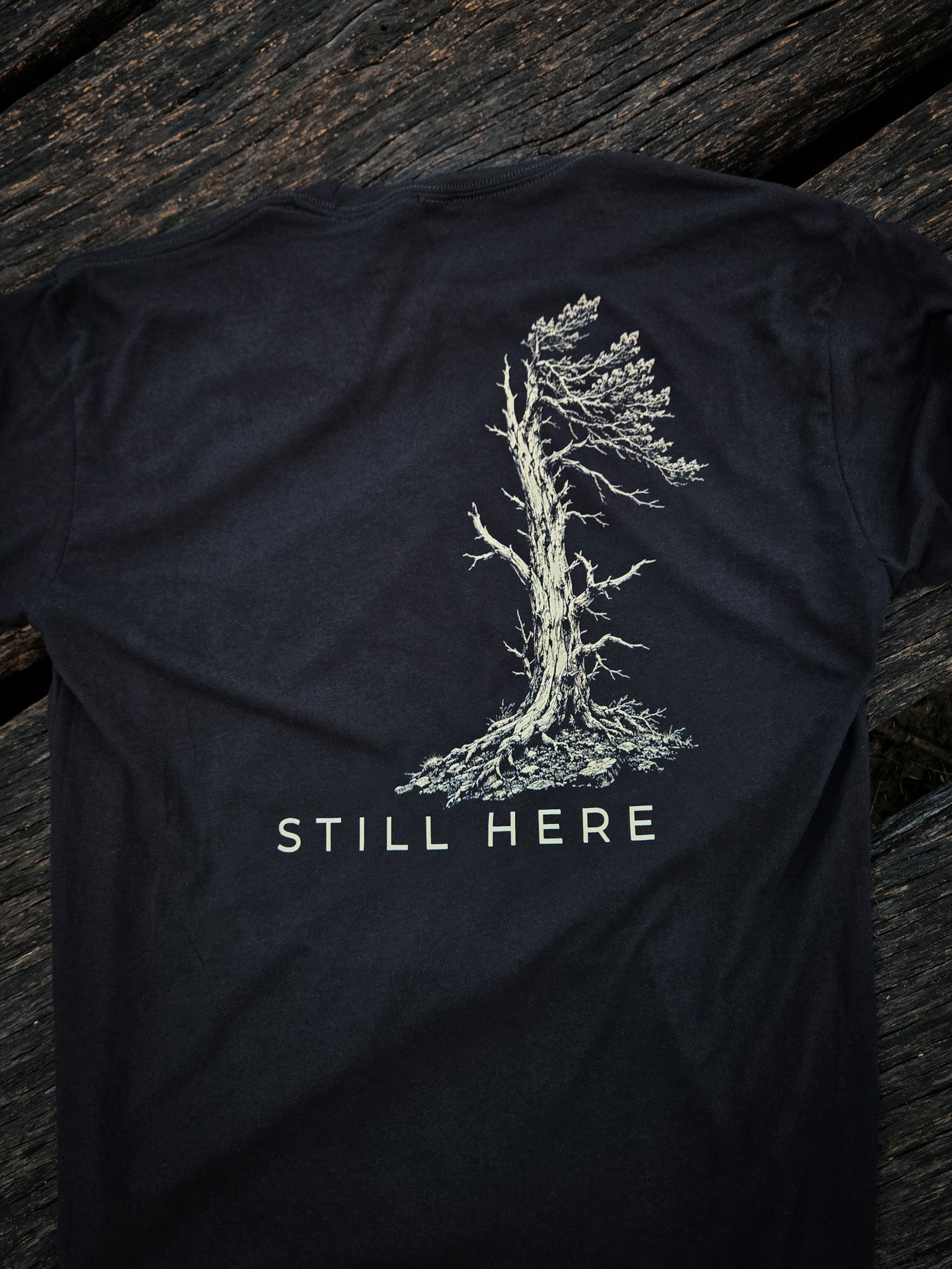 Back of the Still Standing outdoor shirt by Black Timber Goods featuring the weather tree graphic.