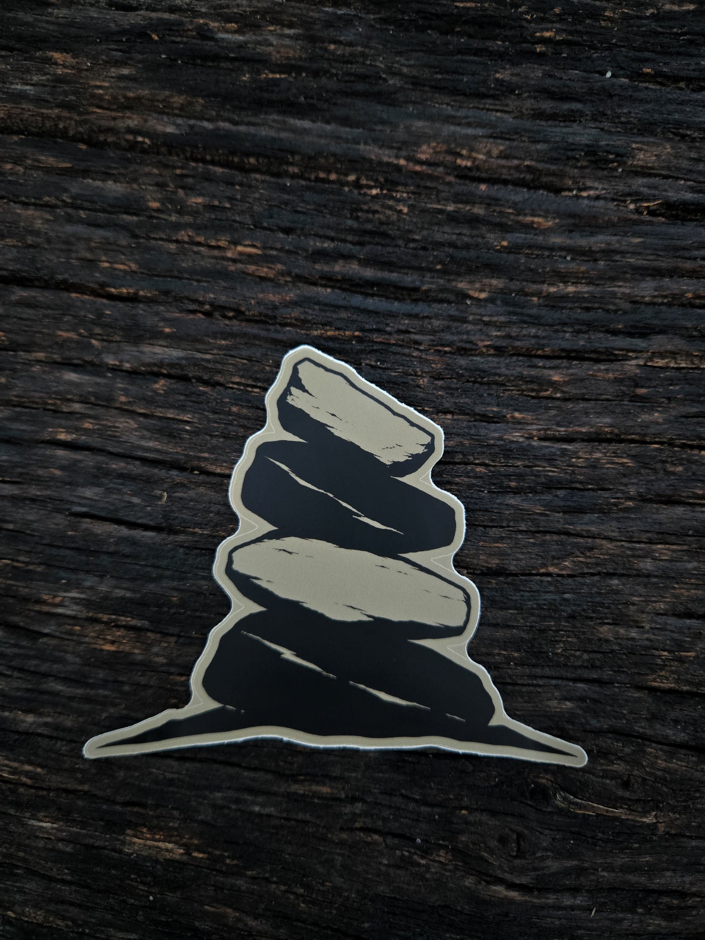 The Long Way In cairn waterproof vinyl sticker by Black Timber Goods on weathered wood.