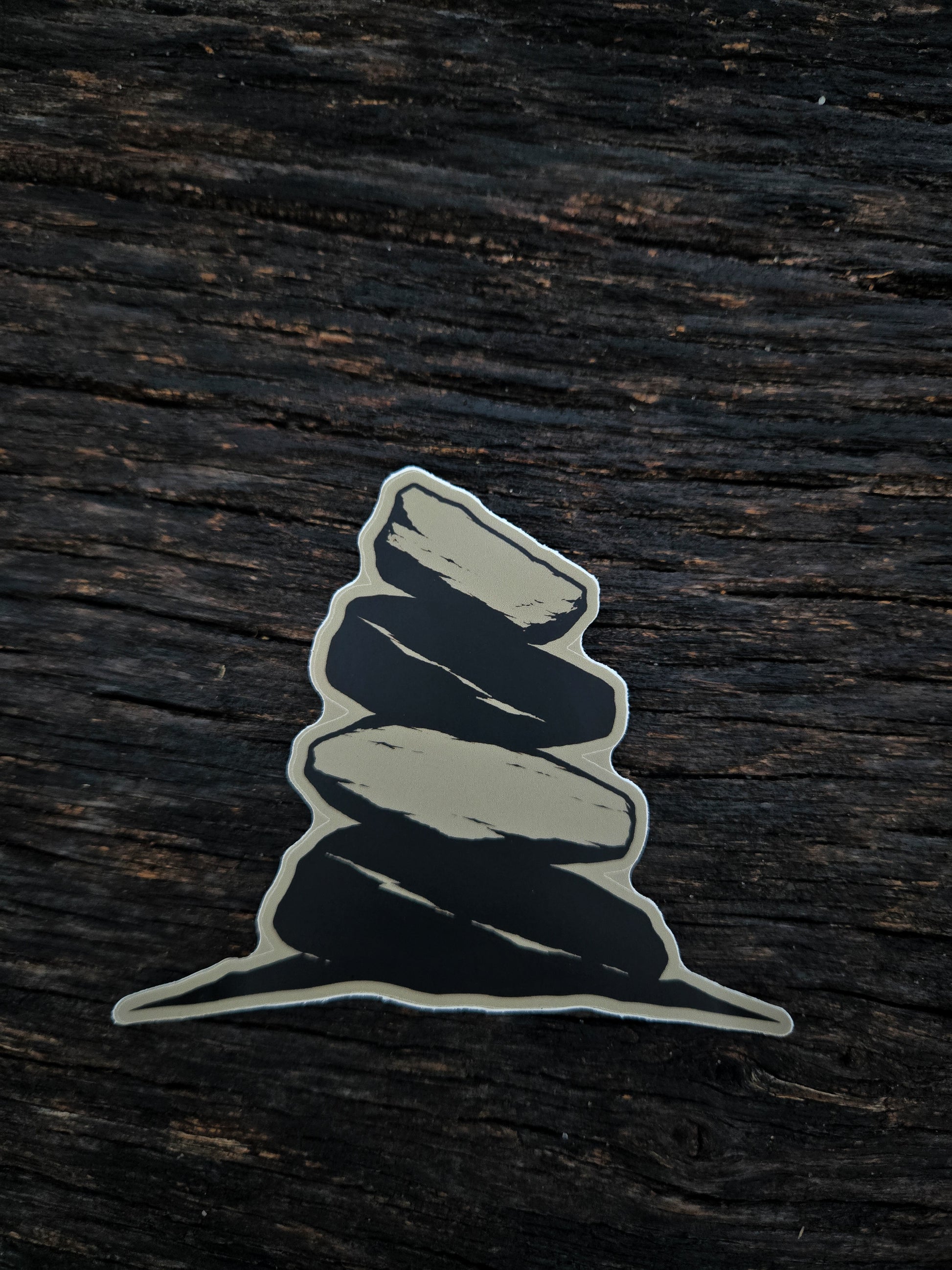 The Long Way In cairn waterproof vinyl sticker by Black Timber Goods on weathered wood.