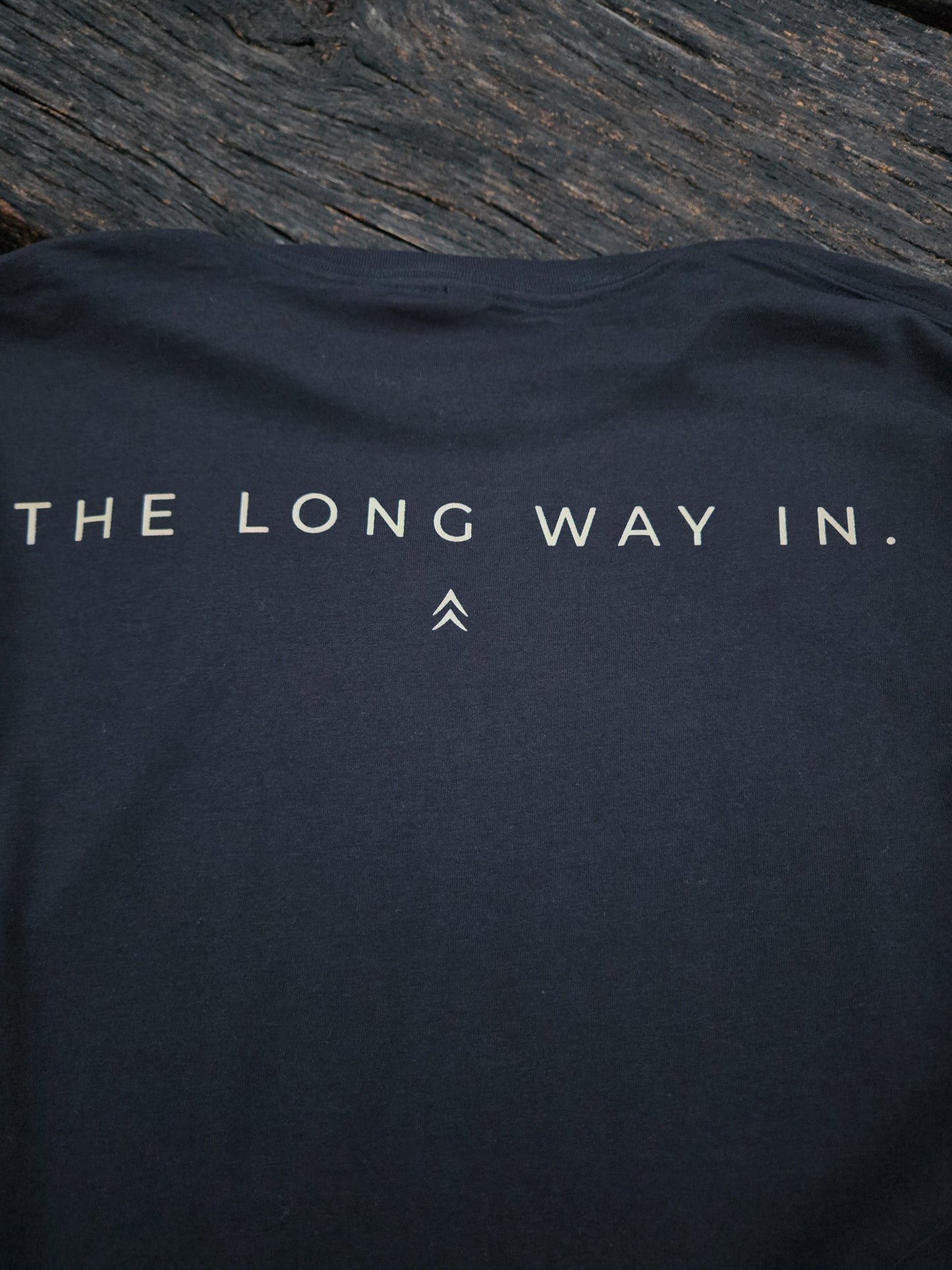 Close-up of The Long Way In typography design on the back of the shirt.