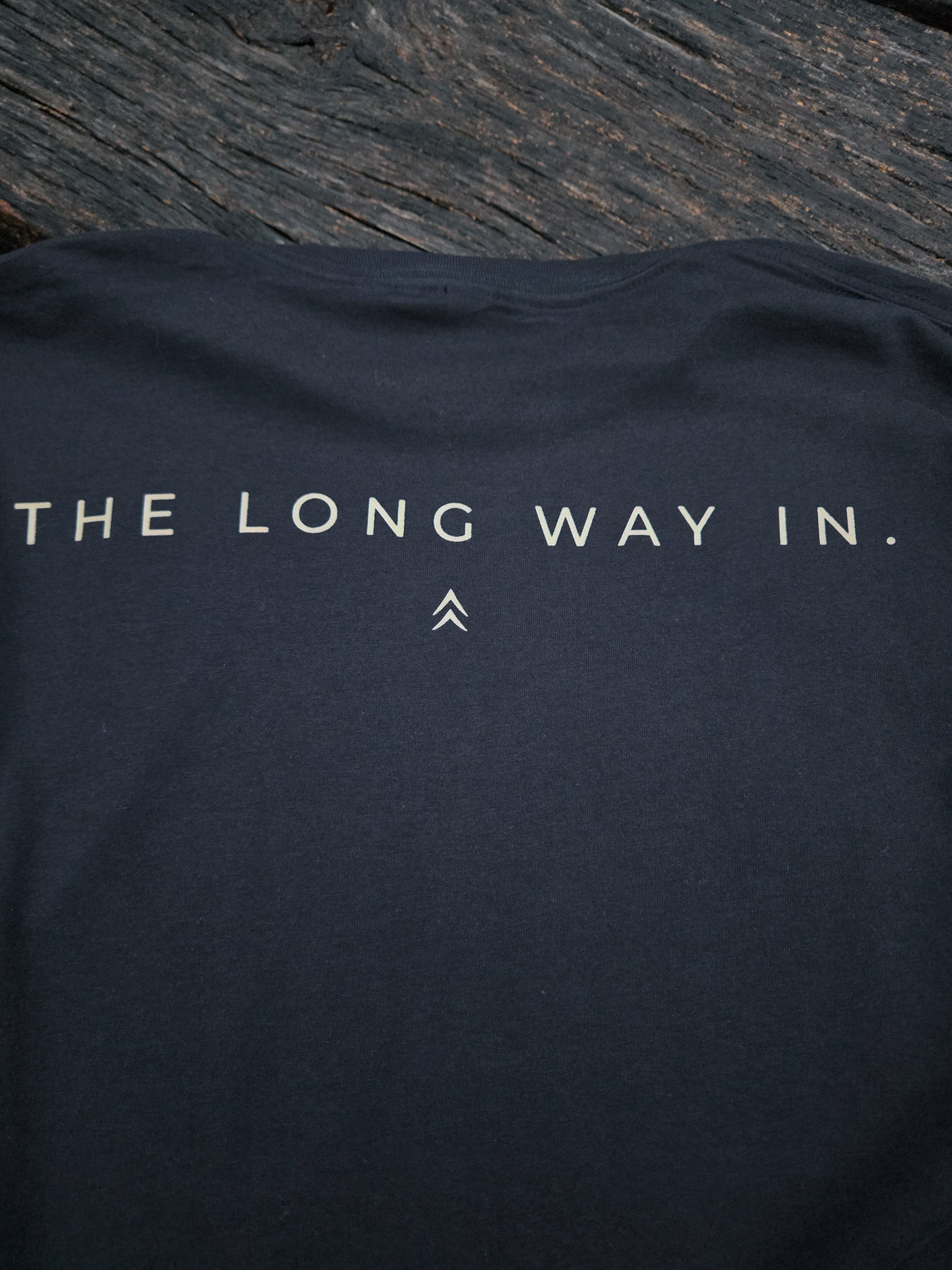 Close-up of The Long Way In typography design on the back of the shirt.