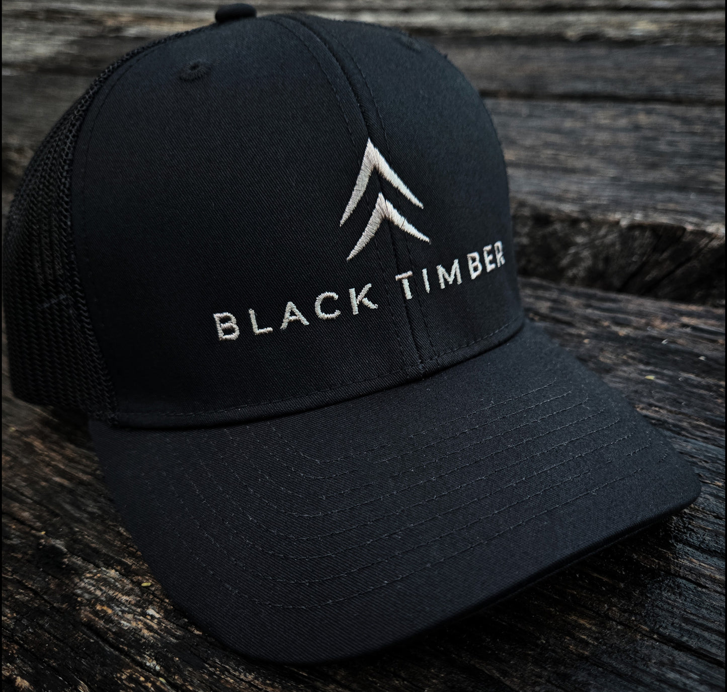Close-up of the Alpine Chevron embroidery on the Timber Mark hat.