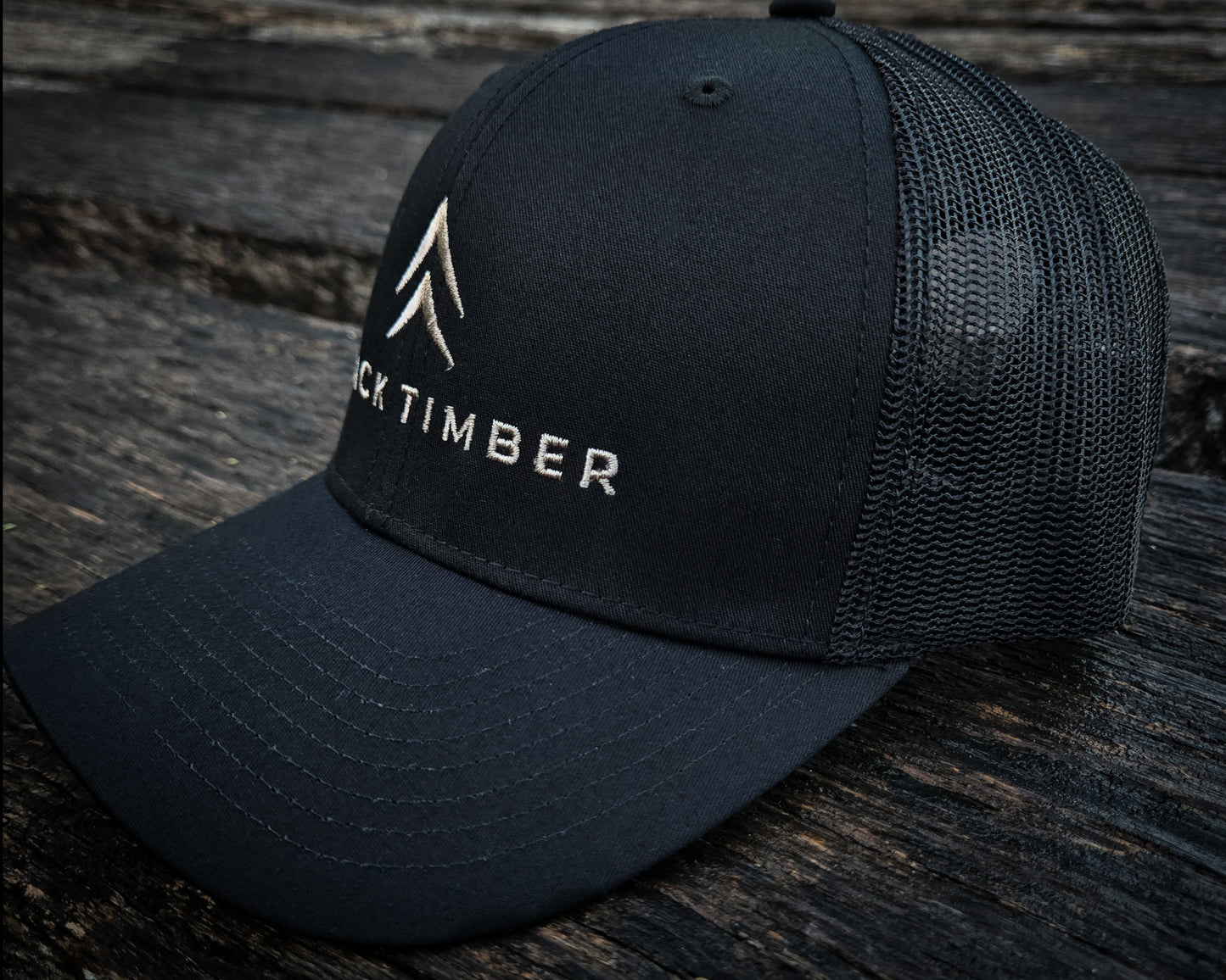 Side view of the Timber Mark trucker hat by Black Timber Goods.