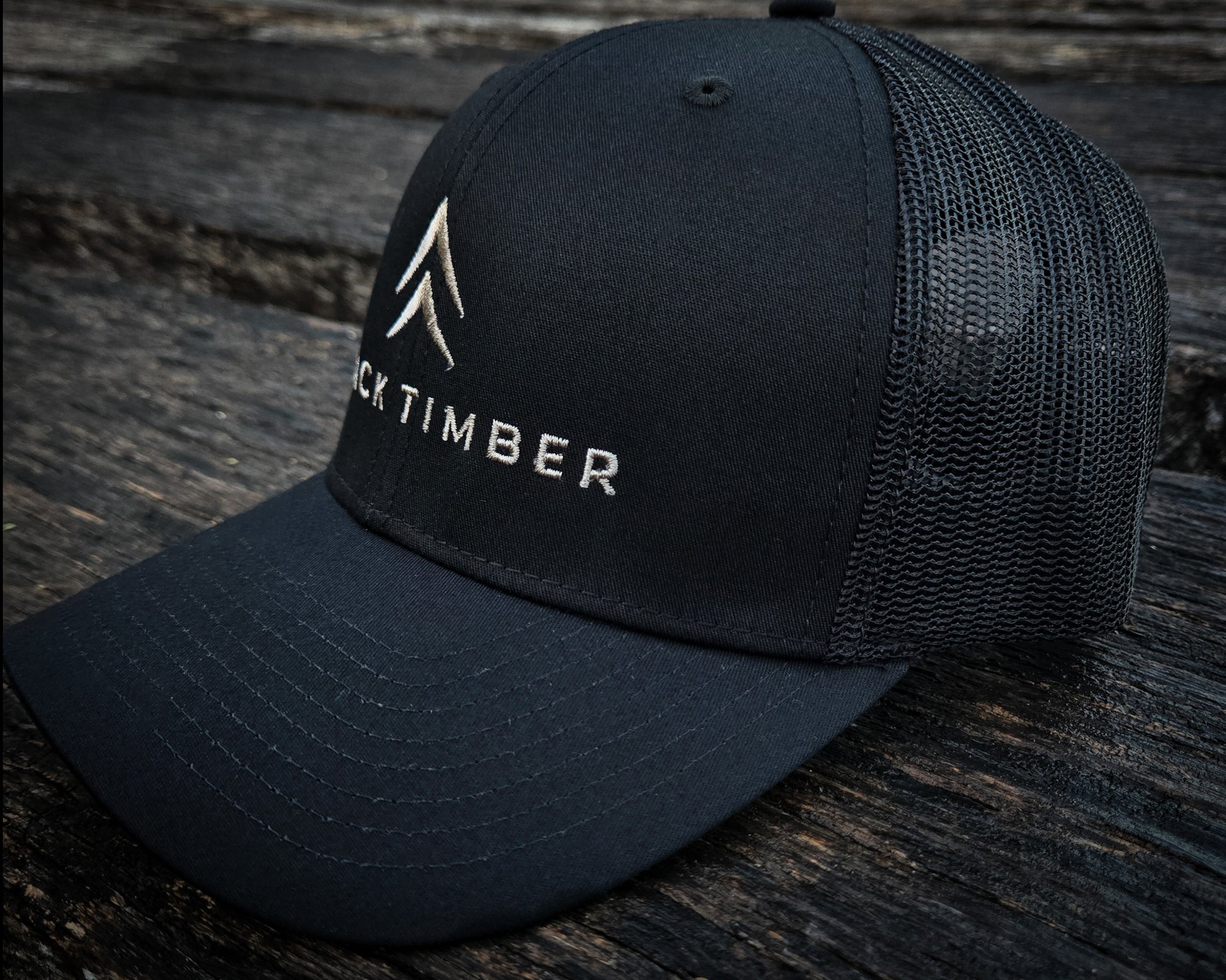 Side view of the Timber Mark trucker hat by Black Timber Goods.
