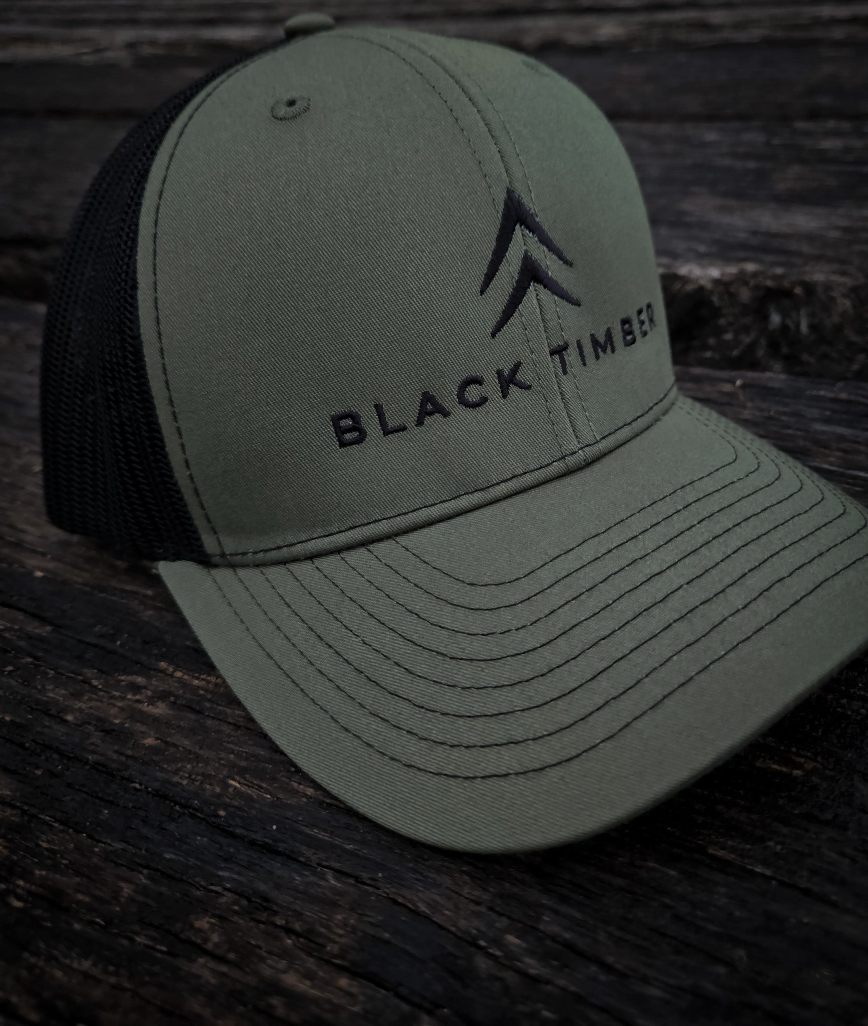 Close-up of the Alpine Chevron embroidery on the Timber Mark hat.