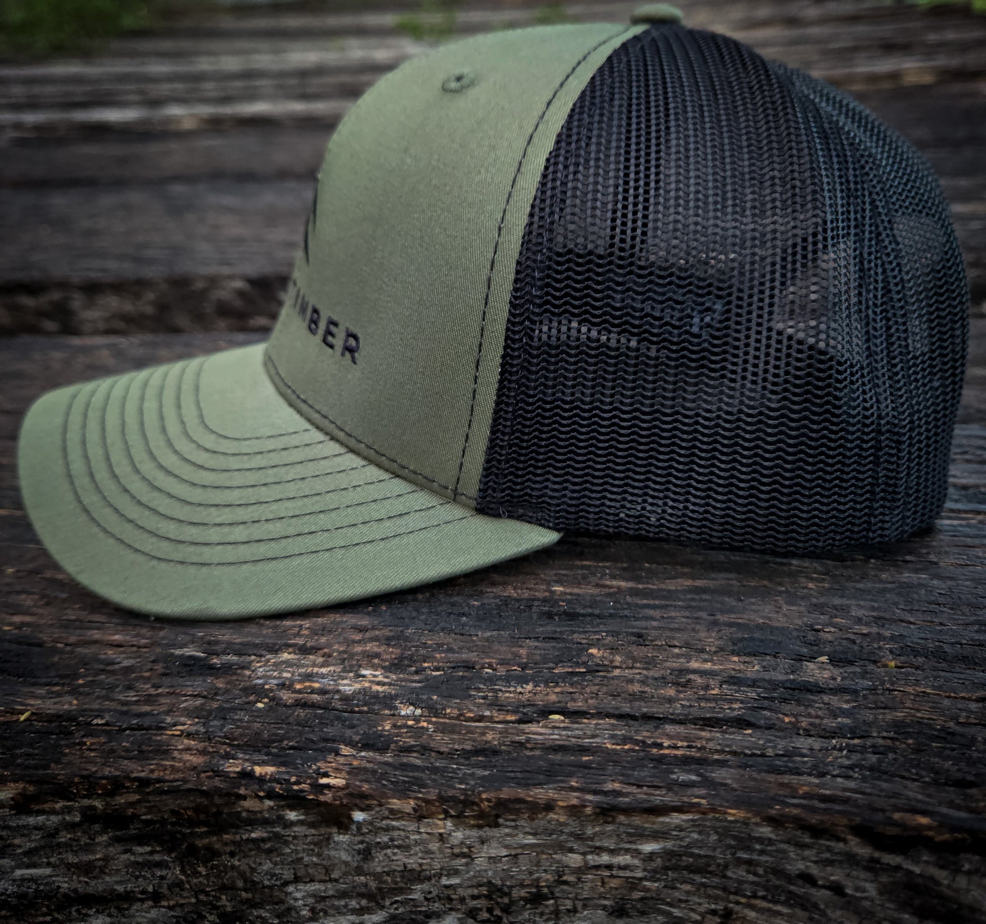 Side view of the Timber Mark trucker hat by Black Timber Goods.