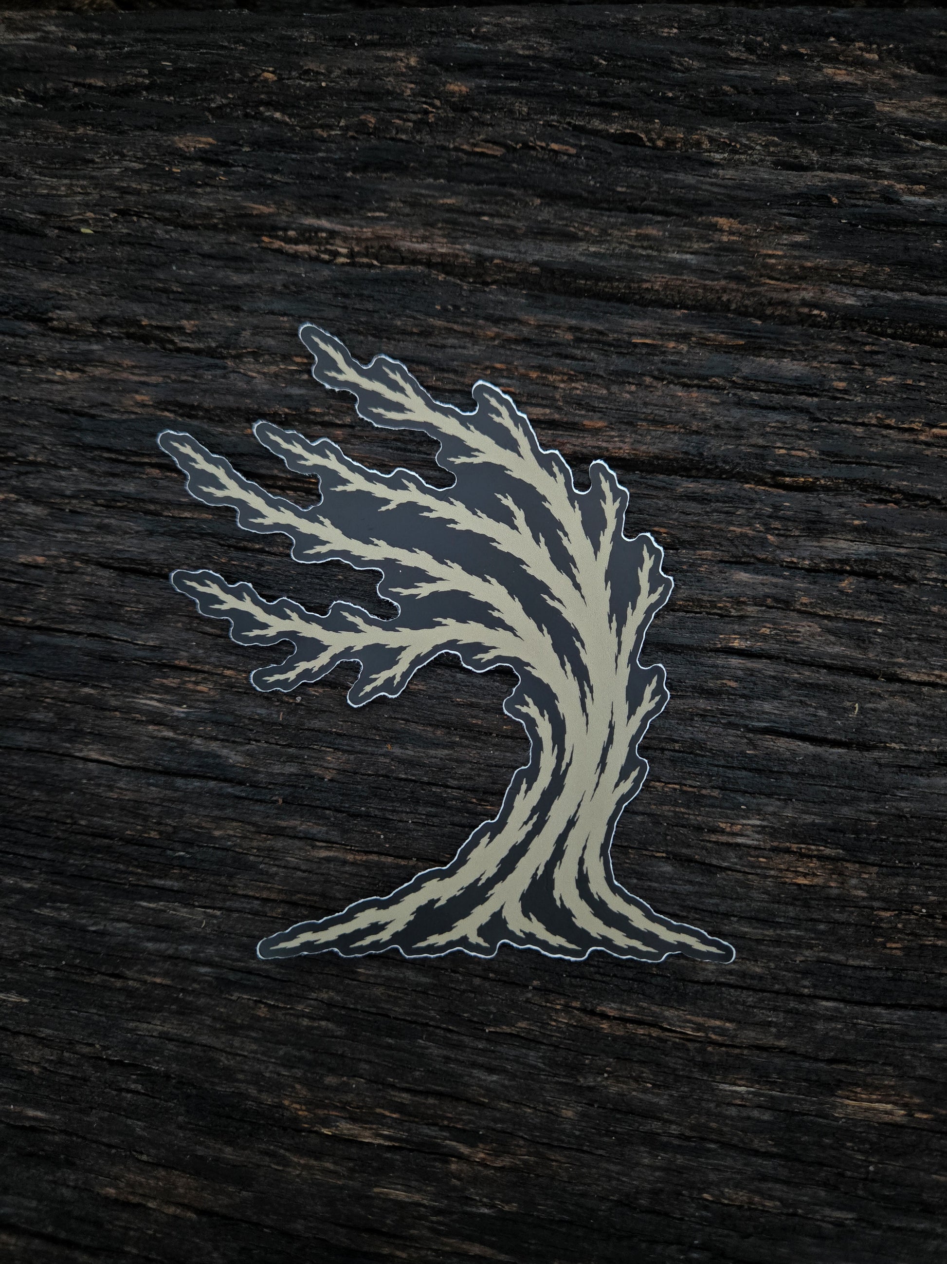 Weather Tree waterproof vinyl sticker by Black Timber Goods on weathered wood.